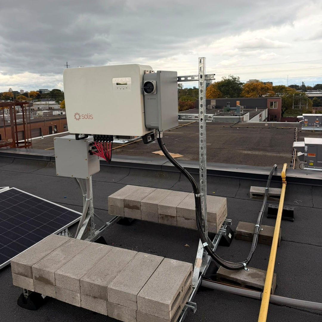 Commercial inverter mounted on a ballasted, non-penetrating rooftop inverter stand on a flat roof